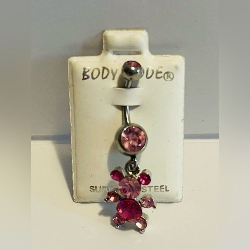 Pink gemstone teddy bear belly ring.